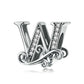 Silver letter charm with black enamel center and zircon inlay details