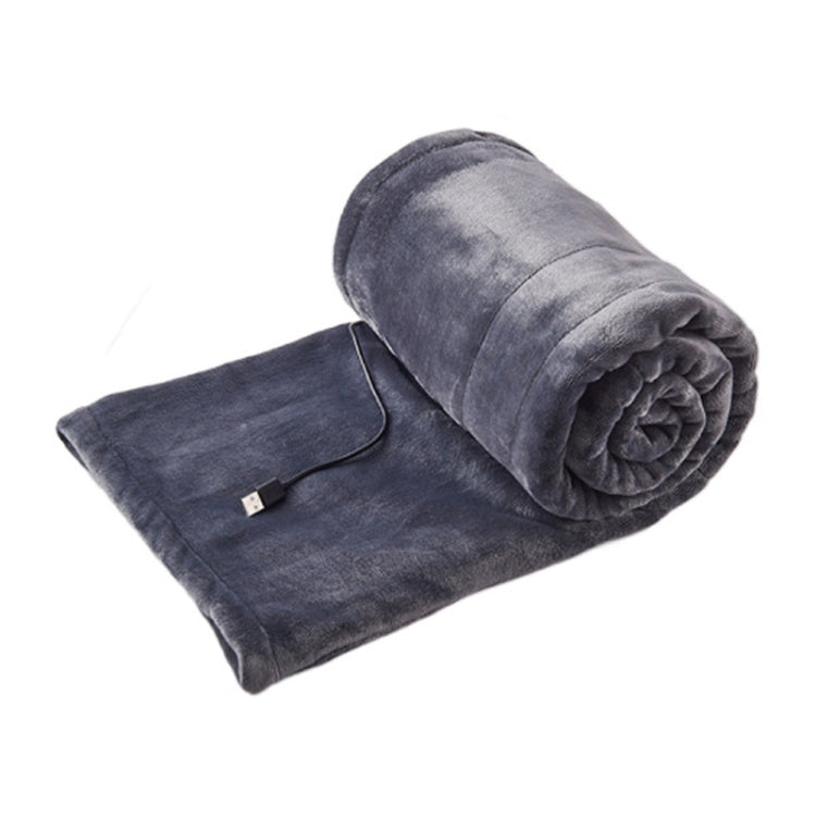 Grey USB electric heating blanket, folded with black controller cord and USB plug
