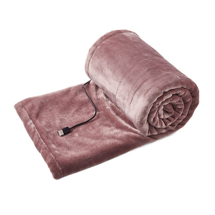 Pink USB electric heating blanket, folded with black controller cord and plug
