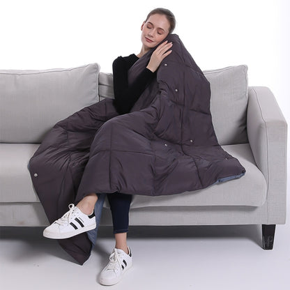 Quilted electric heating shawl blanket, dark fabric with padded panels and wrap design
