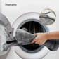 Heated shoulder and neck guard placed in a washing machine drum for cleaning