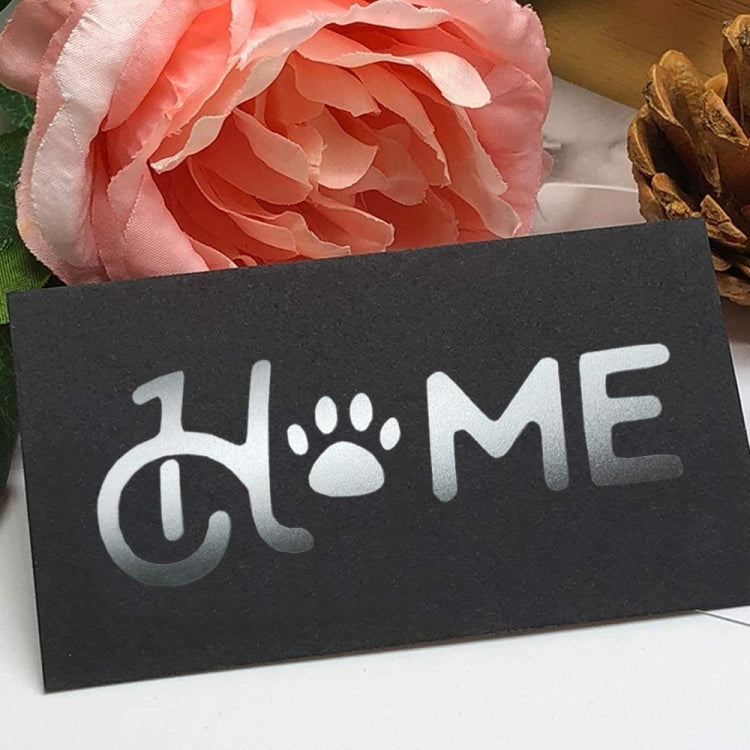 Matte black vinyl lettering sticker with white paw and text design