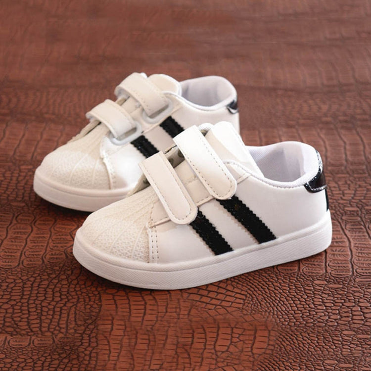 Children's white sneakers with black side stripes and double hook-and-loop straps