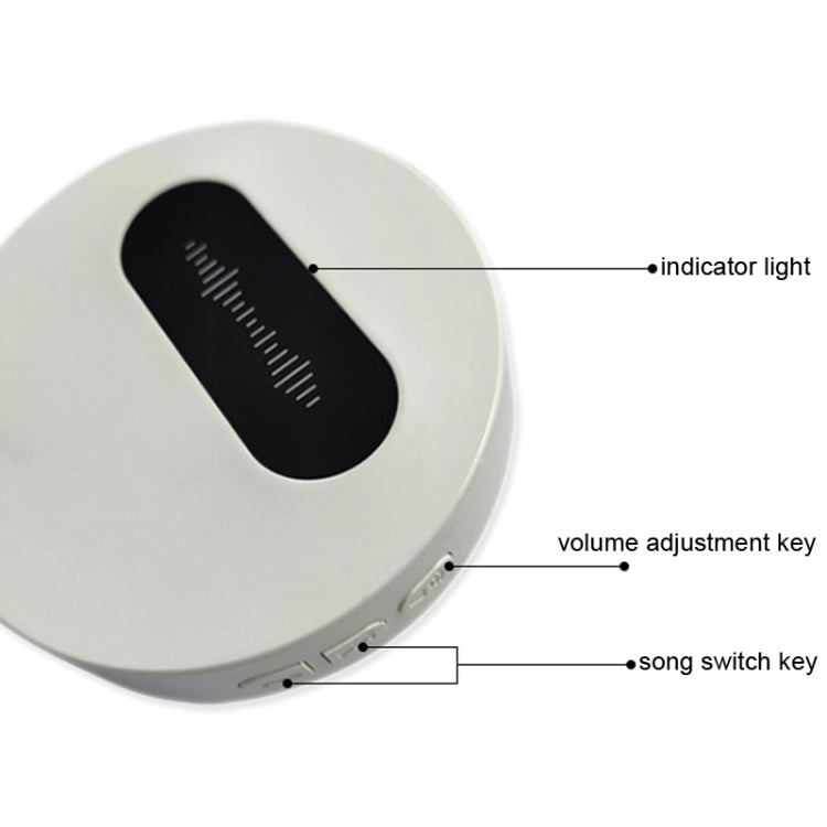 White wireless doorbell front with black sound slot, side keys for volume and song