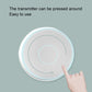 Round white wireless doorbell chime with glowing ring; finger pressing the button.