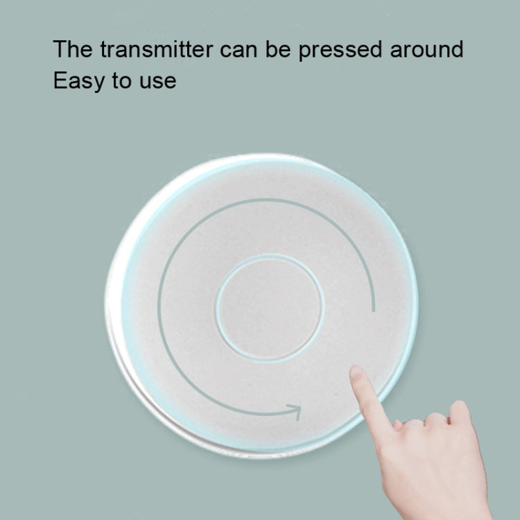 Round white wireless doorbell chime with glowing ring; finger pressing the button.