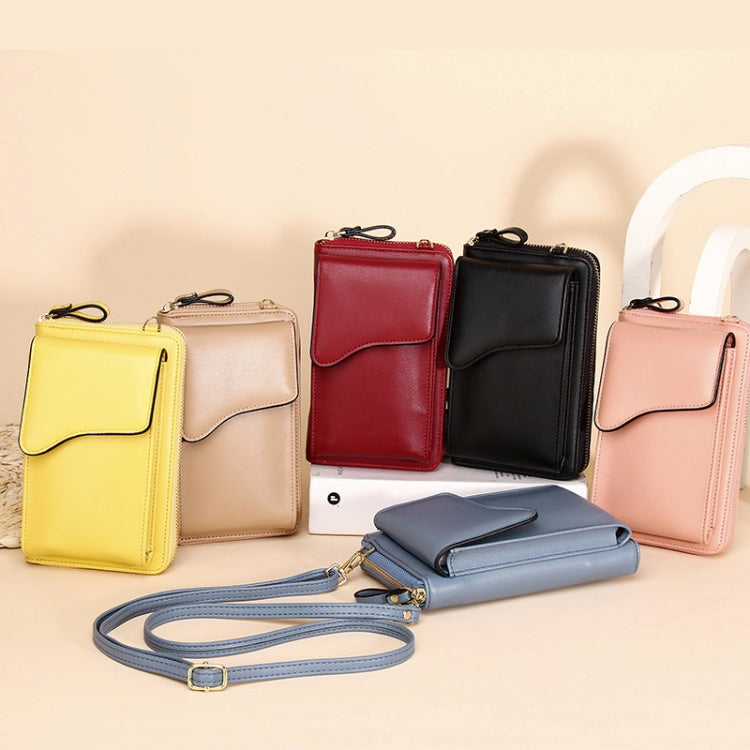 Multi-color crossbody wallet bags with front flap and shoulder straps.