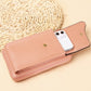Blush pink crossbody wallet with phone slot and card slots plus snap button.