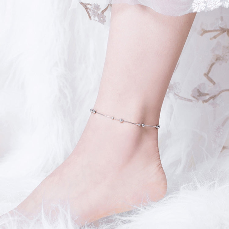 S925 silver ball-charm anklet worn on ankle with thin chain and clasp