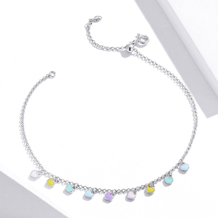 Silver heart charm anklet with pastel blue, pink, green, and purple hearts