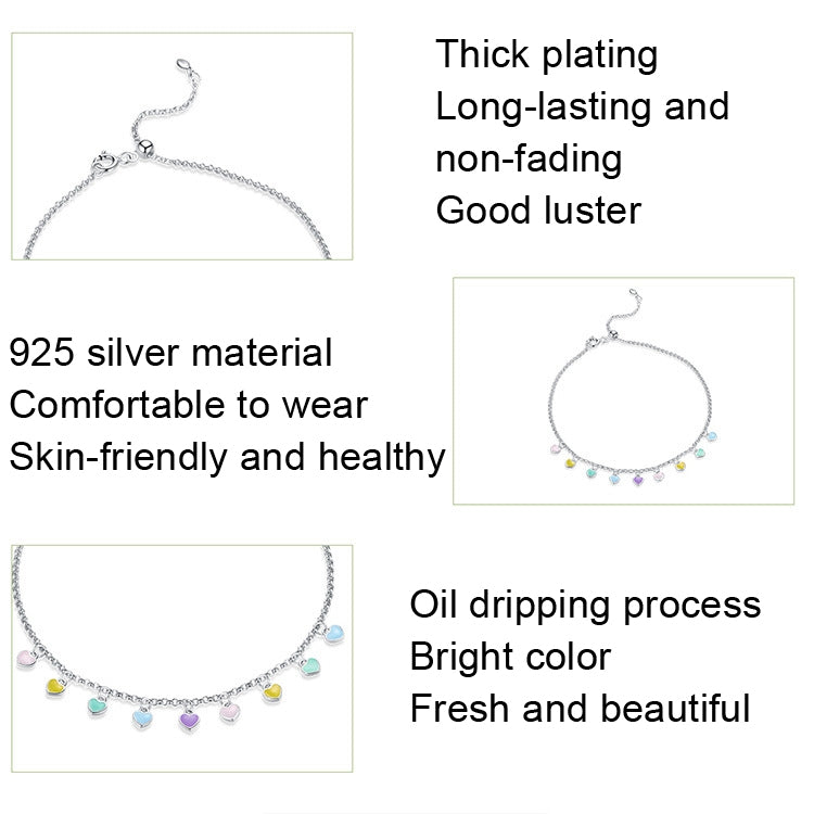 Silver anklet with small multicolor heart charms arranged along the chain