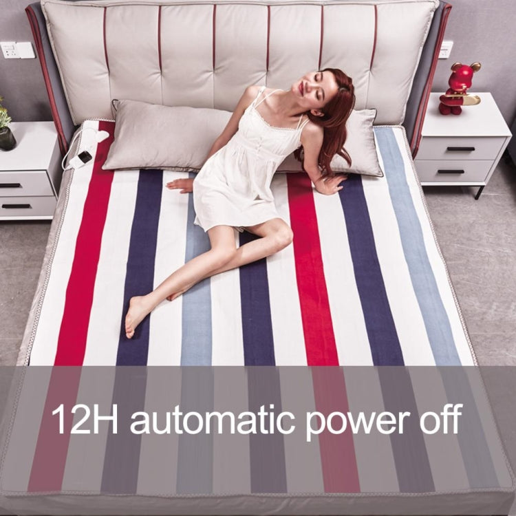 Electric blanket on bed with bold vertical stripes in red, blue, and white; soft top surface