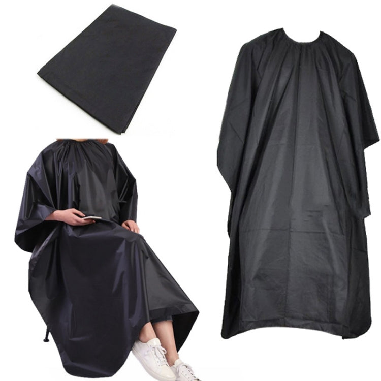 Black waterproof hair dye apron cape with folded protective cloth and drape