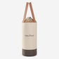 Beige round lunch bag with drawstring closure and two handles, dark brown bottom
