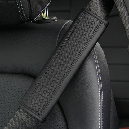 Car seat belt shoulder cover protector in dark textured leather with light edge stitching