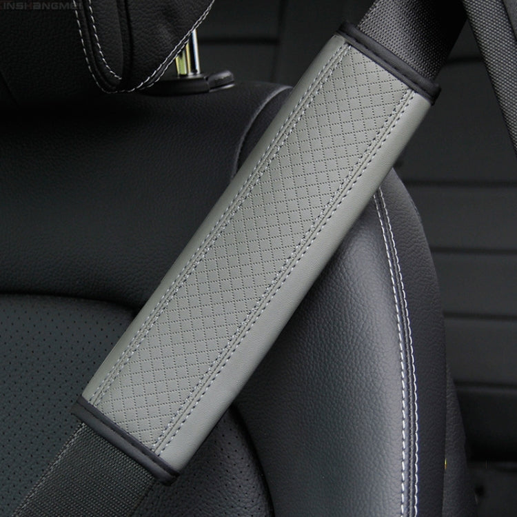 Car seat belt shoulder cover protector in light gray textured leather with white edge stitching