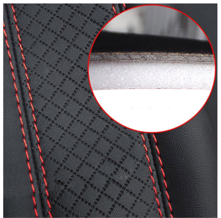 Close-up of textured leather seat belt cover with red stitching and stitched edge