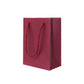 Wine red PU leather gift bag with rope handles and smooth rectangular sides