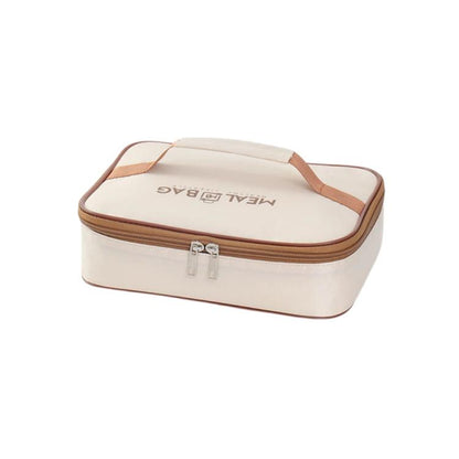 Cream insulated square lunch bag with brown zipper and carry handle tabs, front view