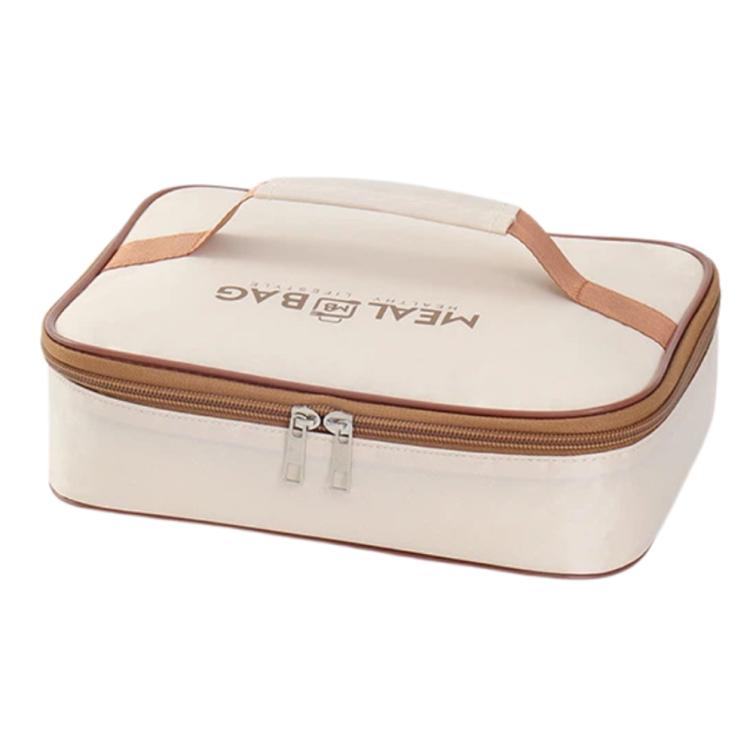 Cream insulated square lunch bag with brown zipper trim and logo on lid, close angle