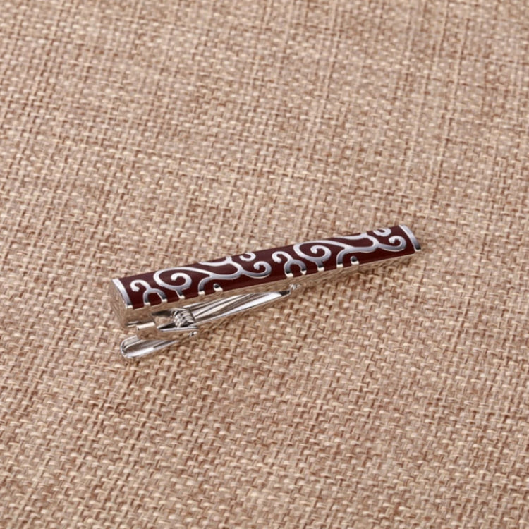 Red-and-silver swirl patterned tie clip with hinged clasp