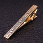 Gold-and-silver swirl patterned tie clip with hinged clasp