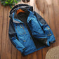 Men's outdoor jacket with fleece lining, blue shell with black hood, front zipper and pockets