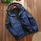 Men's blue outdoor jacket with hood, fleece inner lining, and front zip with pull tab