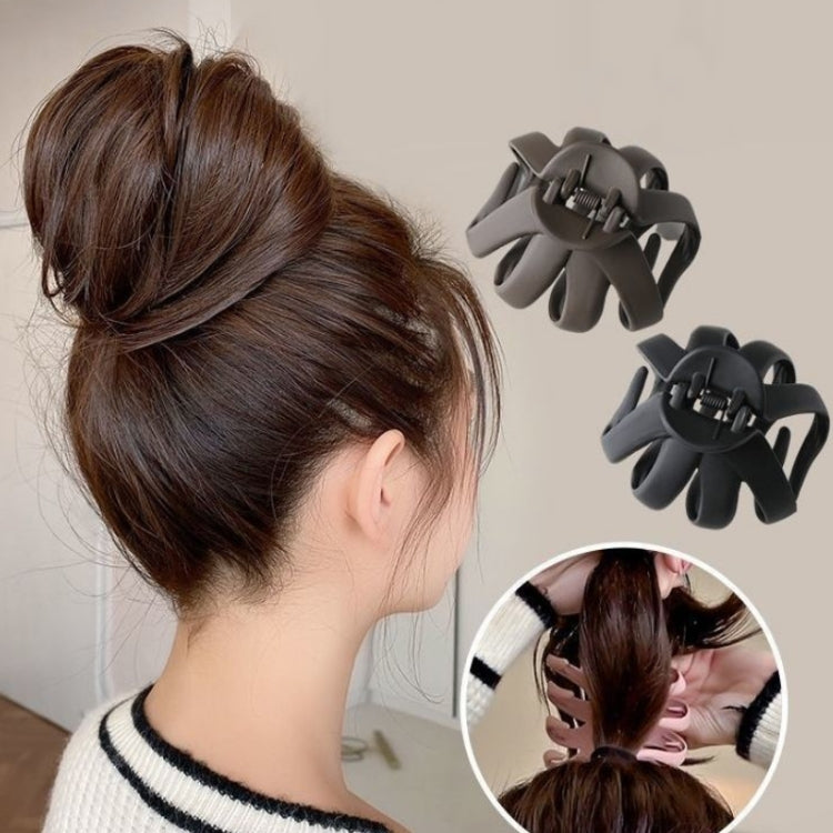 Set of dark claw hair clips with frosted texture; two clips shown