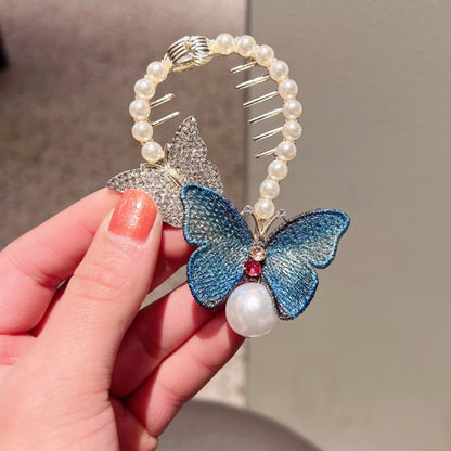 Blue glitter butterfly hair clip with pearl beaded frame, comb teeth, and pearl drop