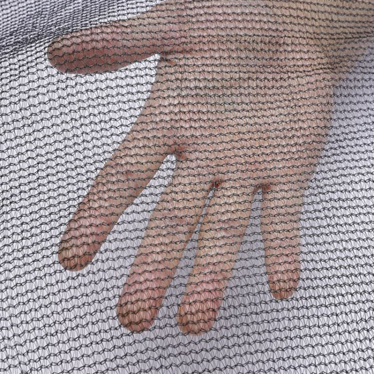 Outdoor trampoline safety net with dark mesh enclosure and vertical poles