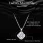 Round moissanite pendant necklace on silver chain with halo bezel setting