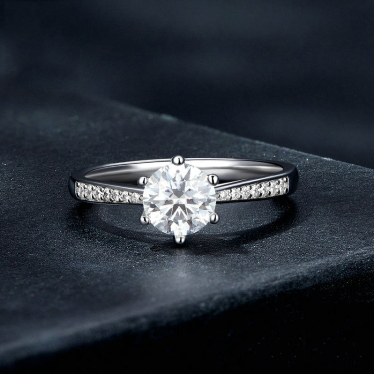 Sterling silver moissanite ring with six-claw round stone and pavé band