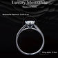 Prong-set moissanite ring with round center stone and slim band