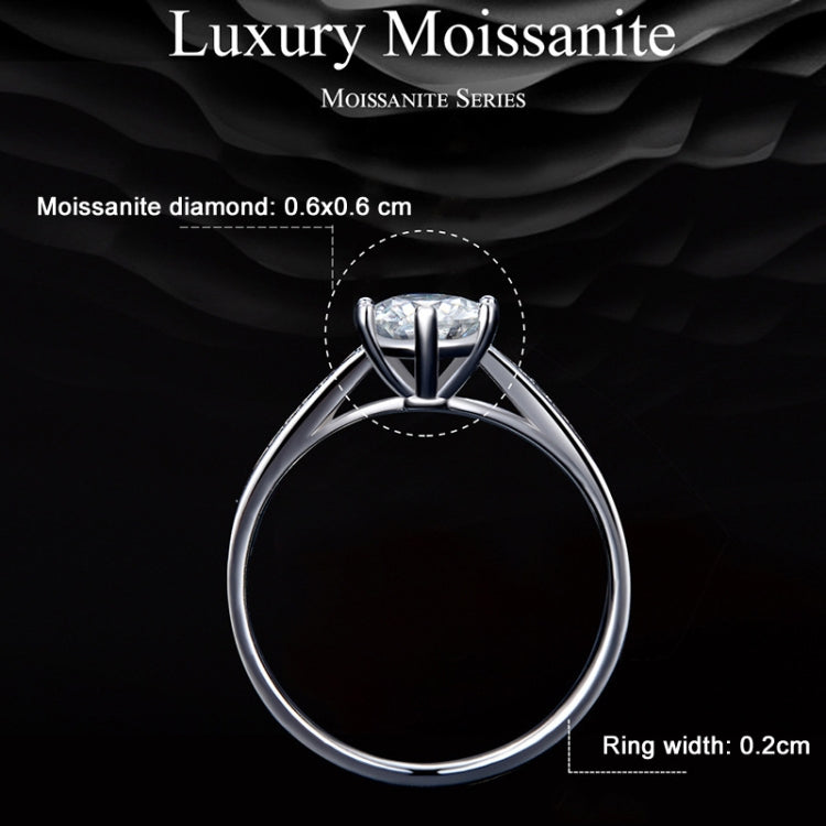 Prong-set moissanite ring with round center stone and slim band