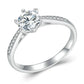 Sterling silver six-claw moissanite ring with pavé accents and white gold plating