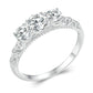 Sterling silver ring with raised filigree band and five round moissanite-style stones