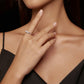 Moissanite-style sterling silver ring worn on hand with small round stones