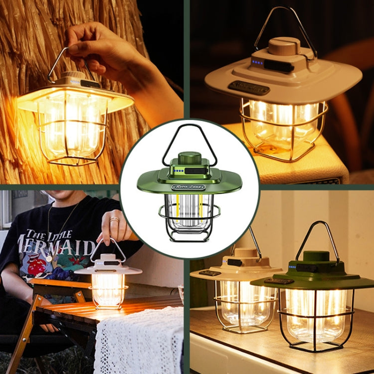 LED retro lantern with hanging handle in green finish, shown with hands holding it.