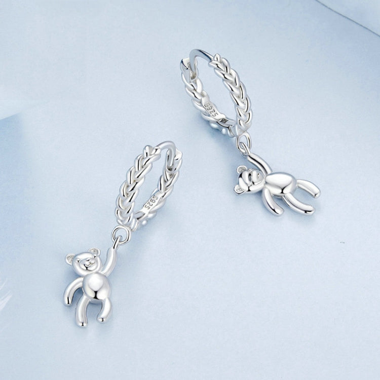 Bear charm hoop earrings with silver-tone chain links and small animal pendant
