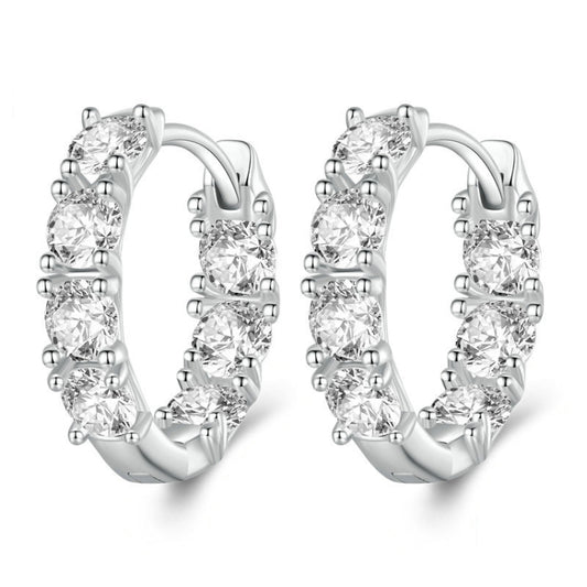 Silver hoop earrings with budding flower zirconia stones arranged along the band