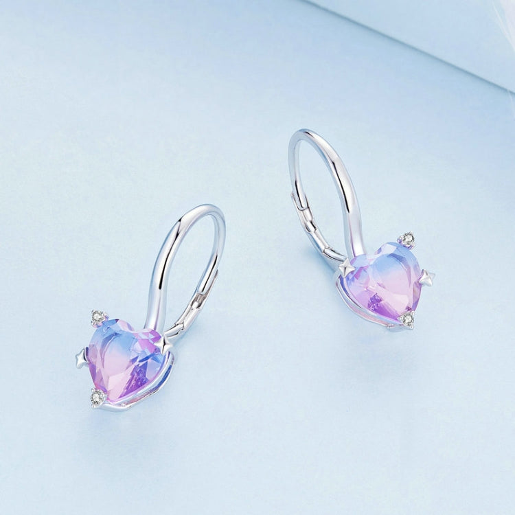 Pair of heart-shaped purple zirconia illusion hoop earrings with prong-set details