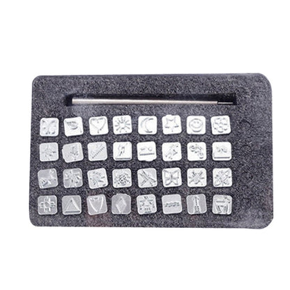 Leather punch stamp set with square metal stamp punches in foam tray