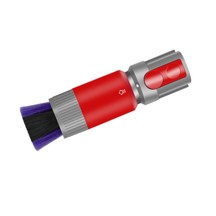 Soft bristle dusting brush angled view, purple and black bristles on red and gray base
