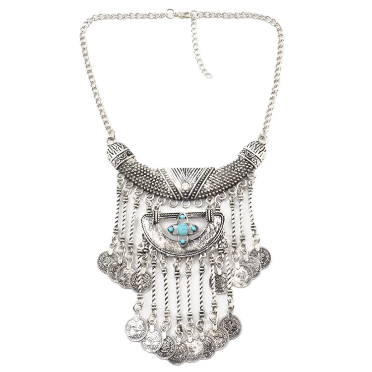 Tassel statement necklace with silver chain, ornate centerpiece, and blue turquoise accents
