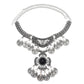 Tassel statement necklace with silver chain, filigree bib, and black center gemstone charm
