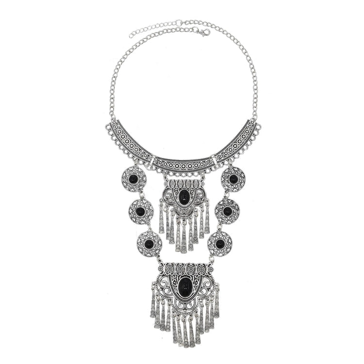 Tassel statement necklace with silver chain and black gemstone filigree centerpiece and drops