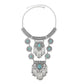 Tassel statement necklace with silver chain and turquoise gemstone centerpiece with dangling tassels