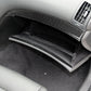 Carbon-fiber style air outlet trim sticker along lower dashboard near passenger-side vent