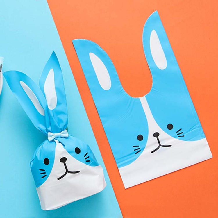 Rabbit-ear gift bag, blue and white with bunny face print, tied closed.